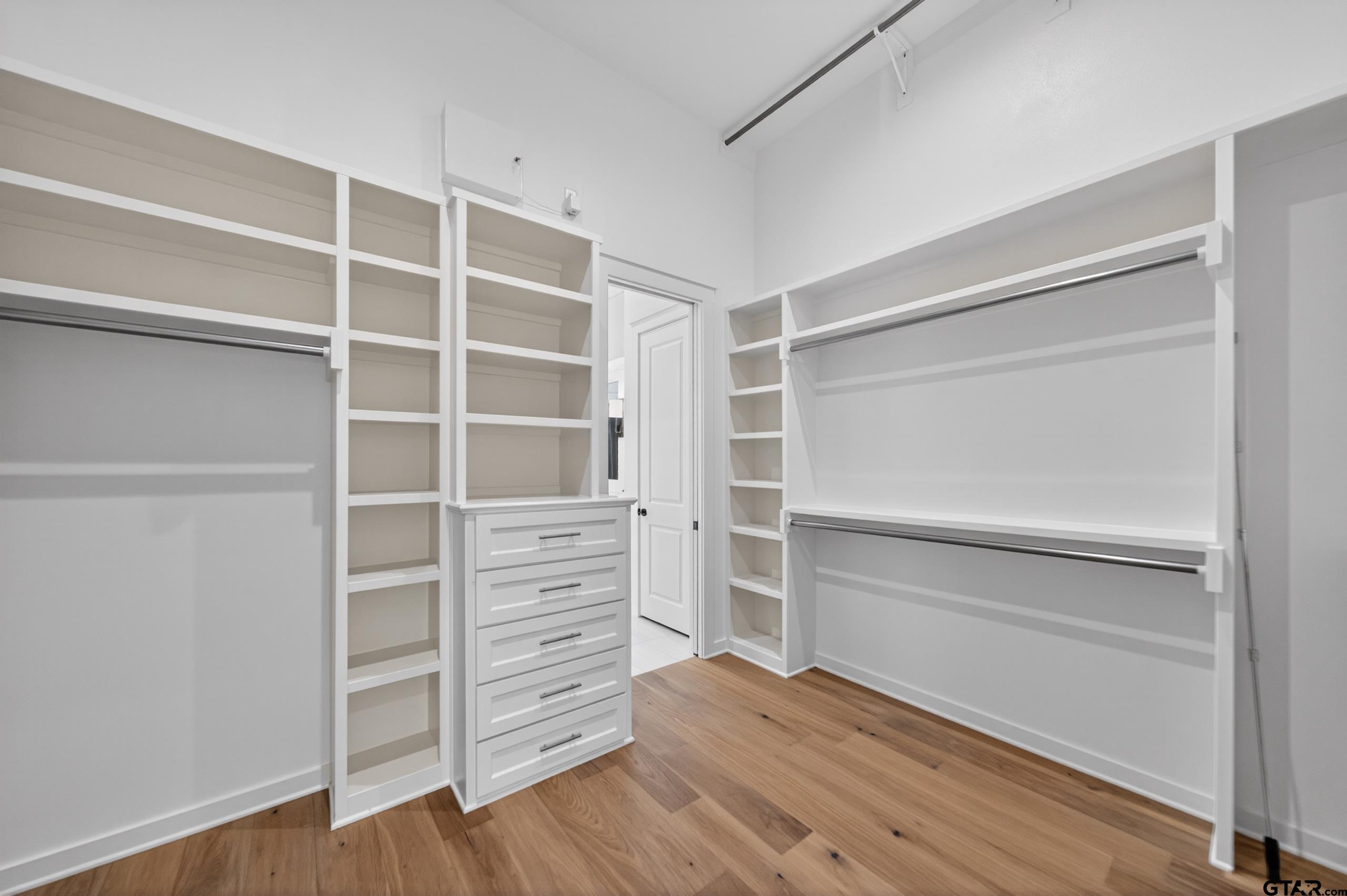 7517 Cross Gate Way Tyler, TX 75703 - Photo 20 of 47 a view of walk in closet with empty racks