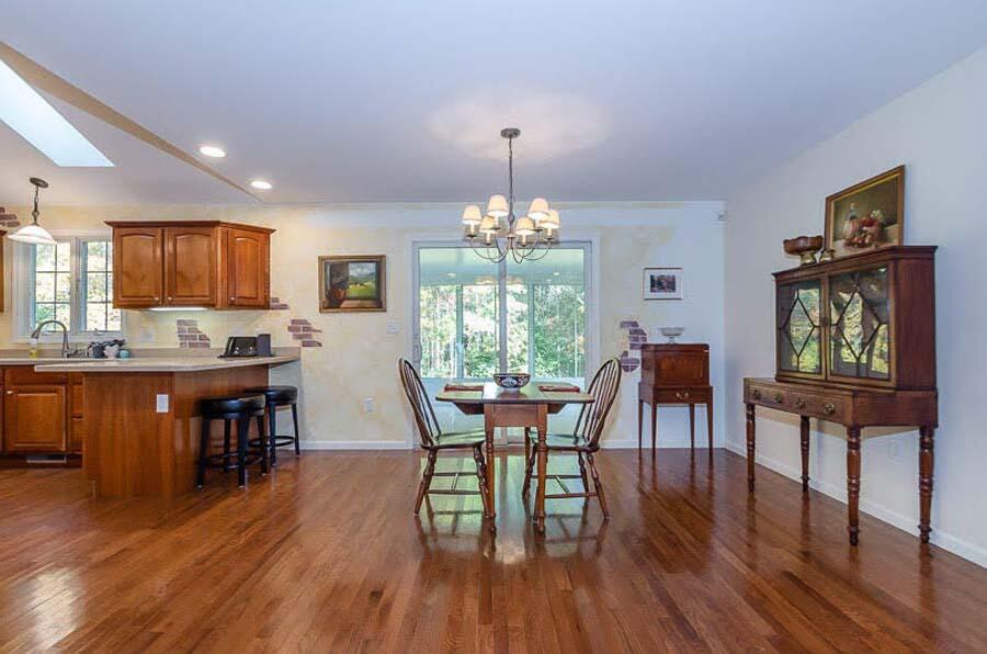 23 Bisbee Drive Rochester, MA 02770 - Photo 6 of 18 a view of a dining room with furniture window and wooden floor