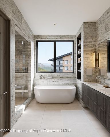 a bathroom with a bathtub a large window and a shower