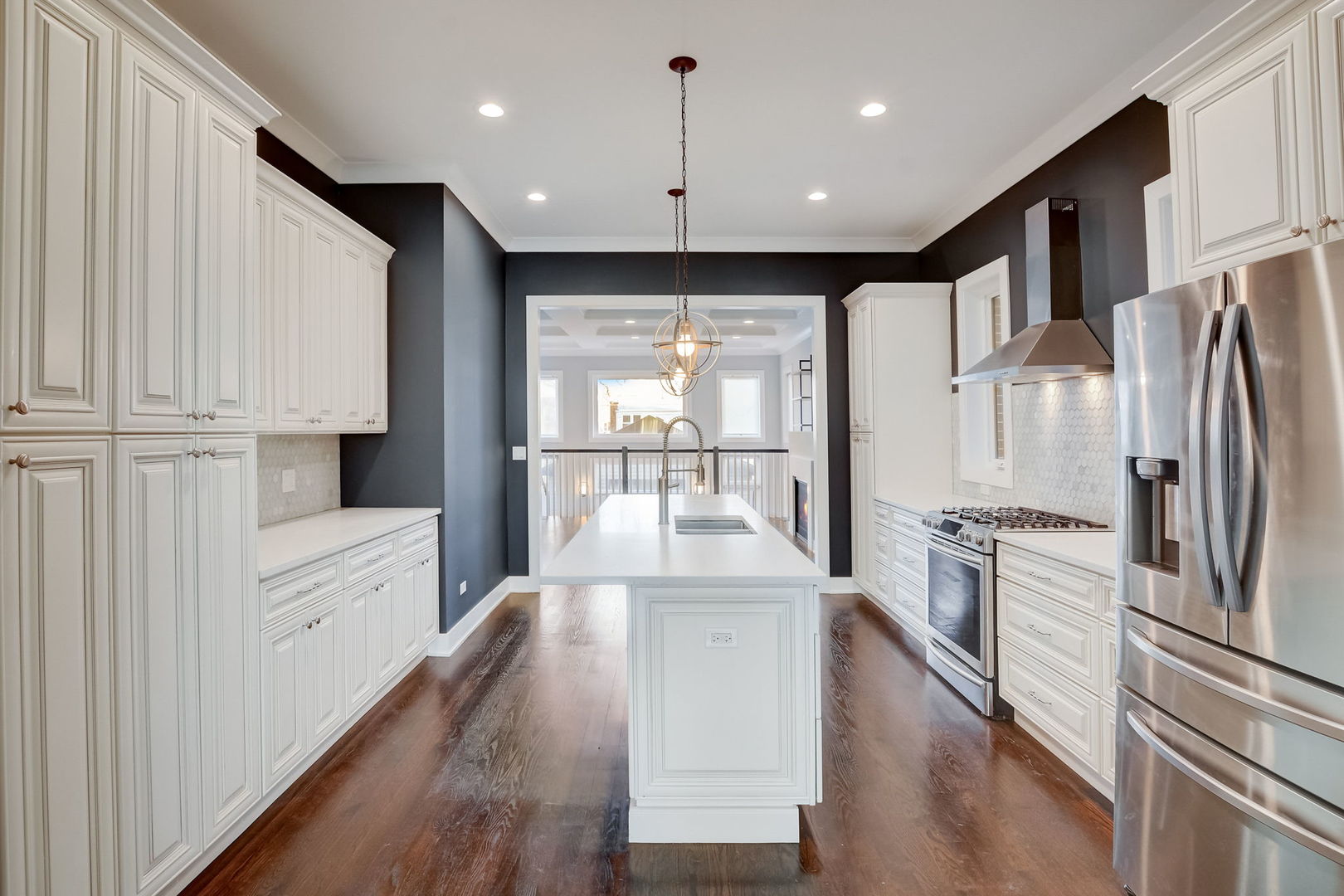 3303 South Racine Avenue Chicago, IL 60608 - Photo 11 of 60 a kitchen with stainless steel appliances a refrigerator and a stove top oven