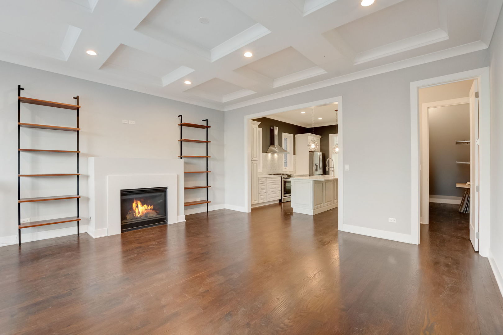 3303 South Racine Avenue Chicago, IL 60608 - Photo 17 of 60 wooden floor in an empty room with a fireplace