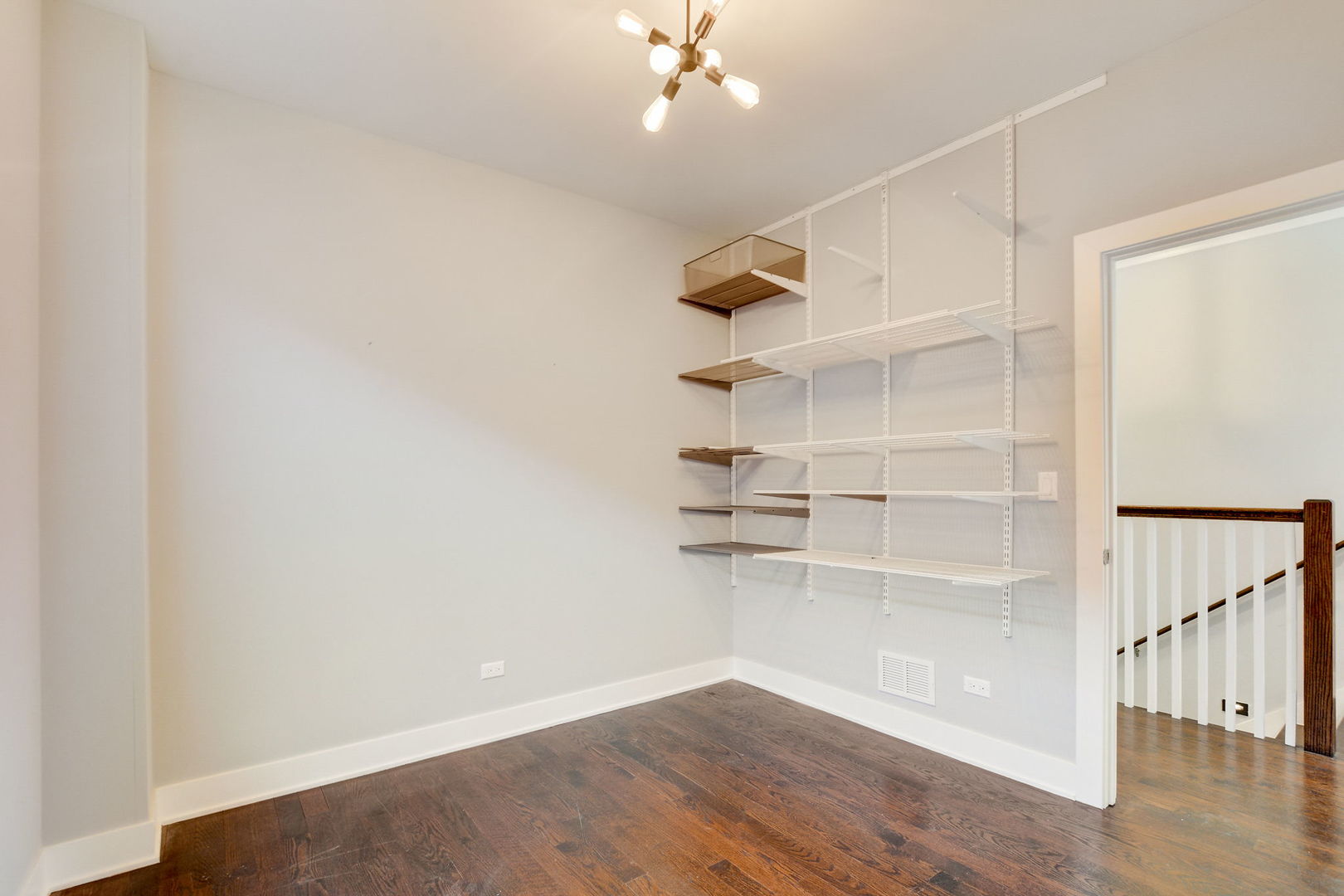 3303 South Racine Avenue Chicago, IL 60608 - Photo 29 of 60 a view of a room with empty racks
