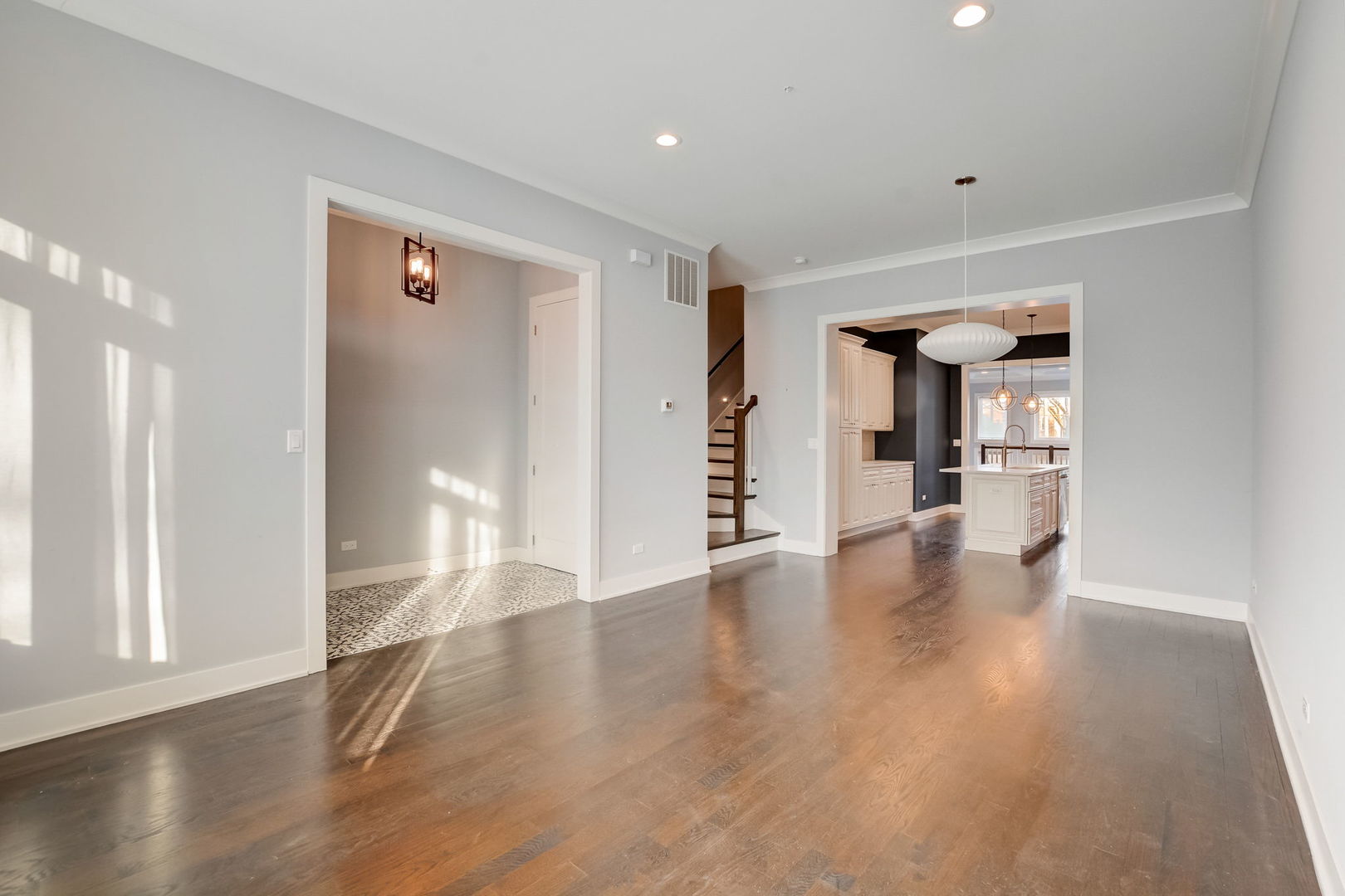3303 South Racine Avenue Chicago, IL 60608 - Photo 3 of 60 a view of an empty room and wooden floor
