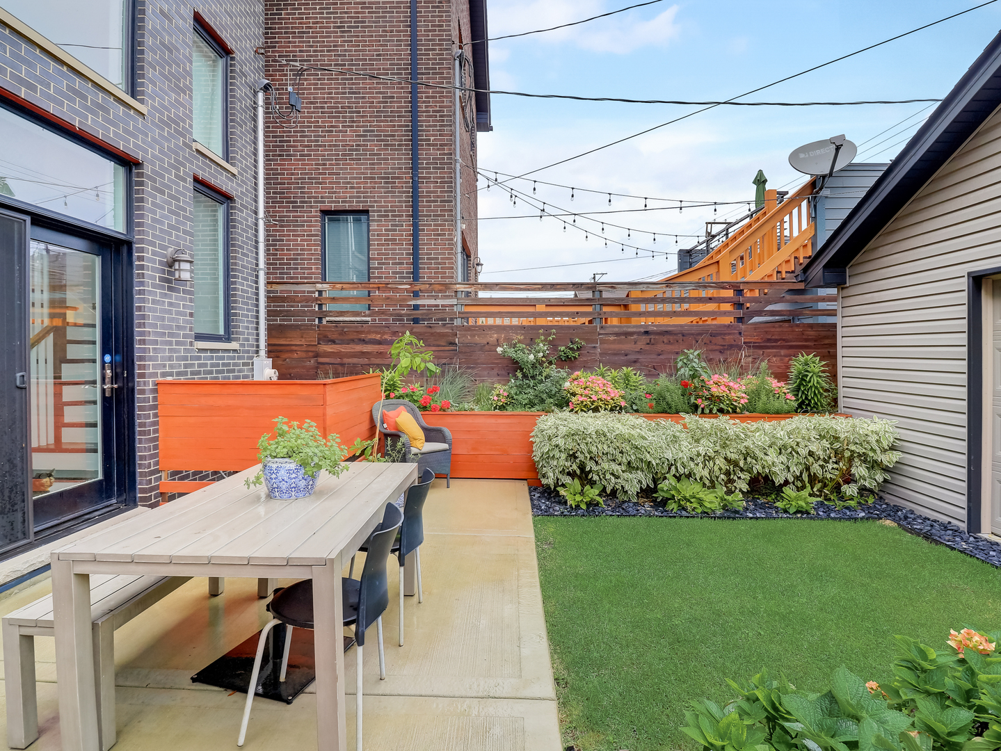 3303 South Racine Avenue Chicago, IL 60608 - Photo 49 of 60 a view of a patio with table and chairs and potted plants
