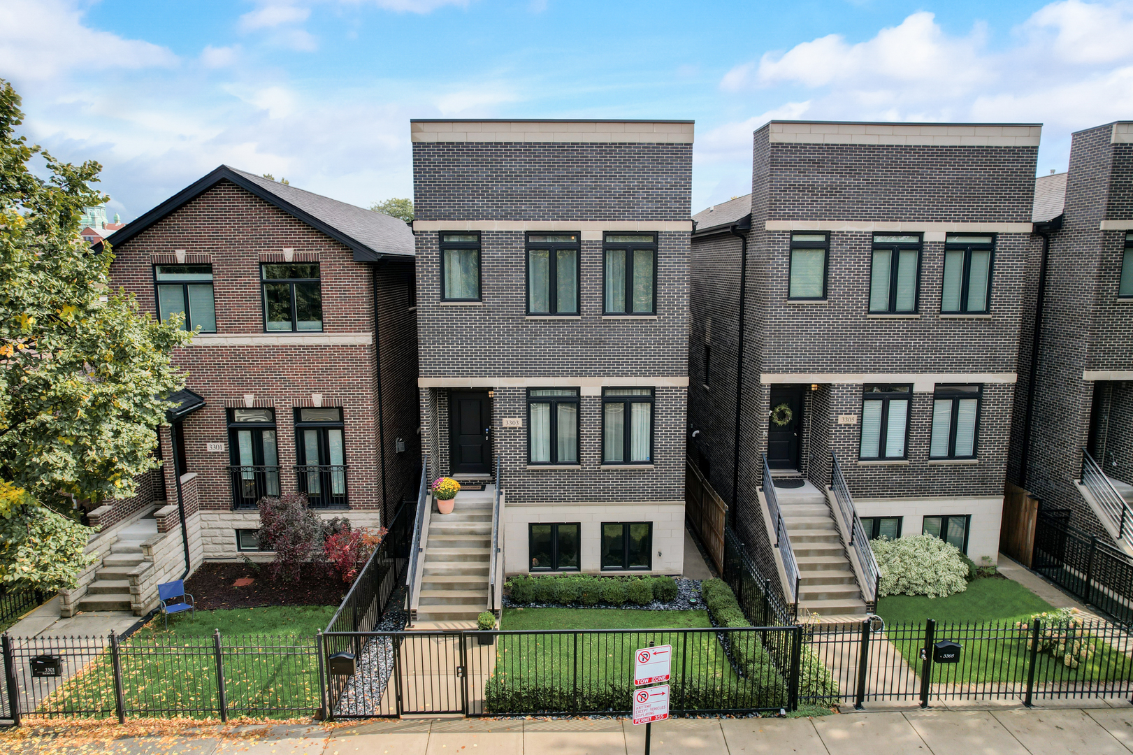 3303 South Racine Avenue Chicago, IL 60608 - Photo 59 of 60 a front view of a house with a yard