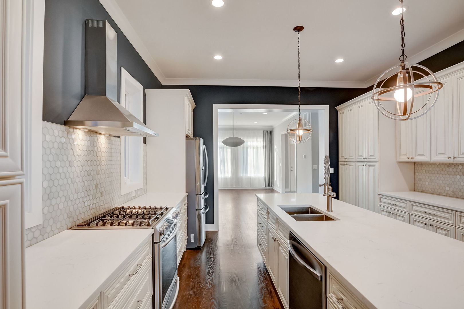 3303 South Racine Avenue Chicago, IL 60608 - Photo 7 of 60 a kitchen with stainless steel appliances a stove a sink a refrigerator and cabinets