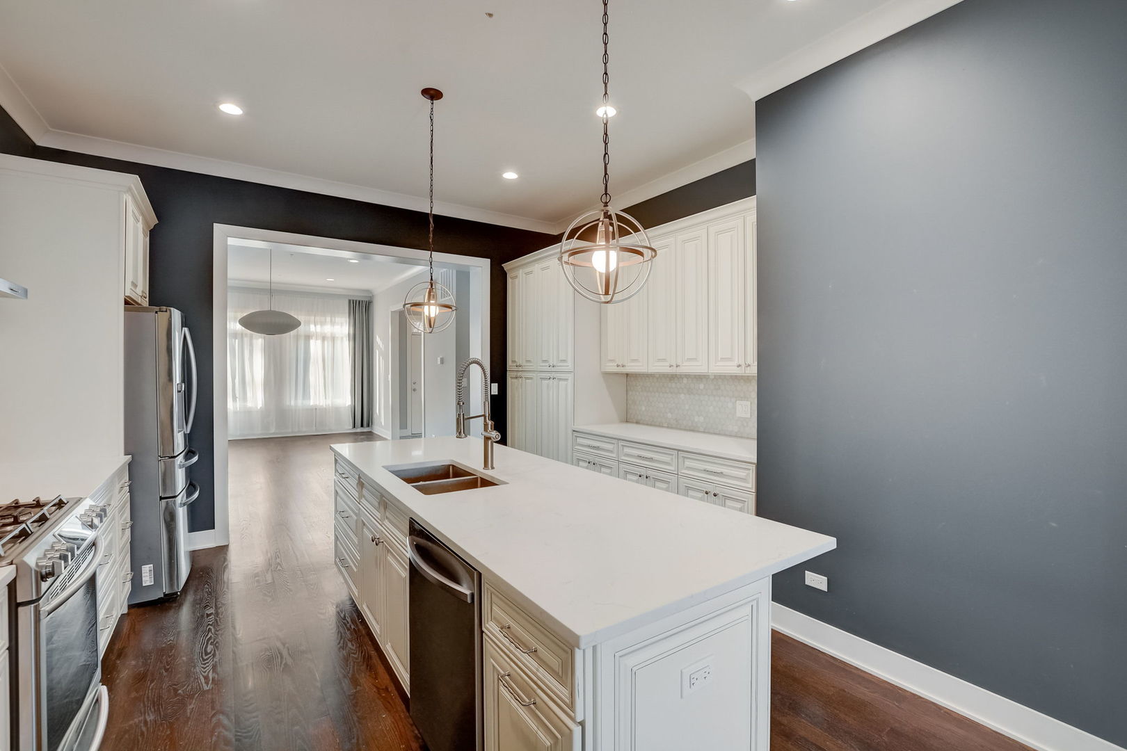3303 South Racine Avenue Chicago, IL 60608 - Photo 8 of 60 a kitchen that has a sink a stove and a refrigerator
