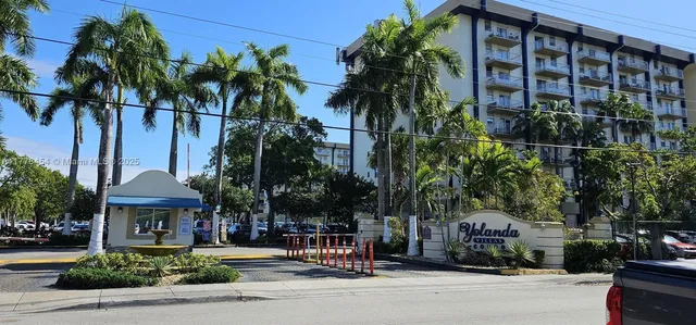 front view of a building with a garden