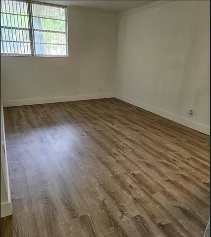 a kitchen with a sink and refrigerator
