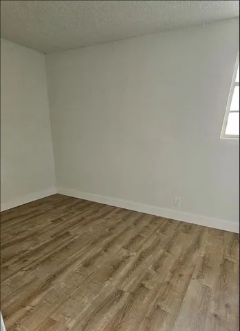 a kitchen with kitchen island a sink stainless steel appliances and cabinets
