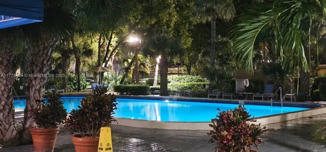 a view of a fountain with swimming pool