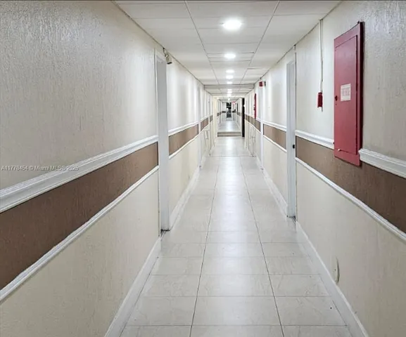 a refrigerator freezer sitting inside of a room
