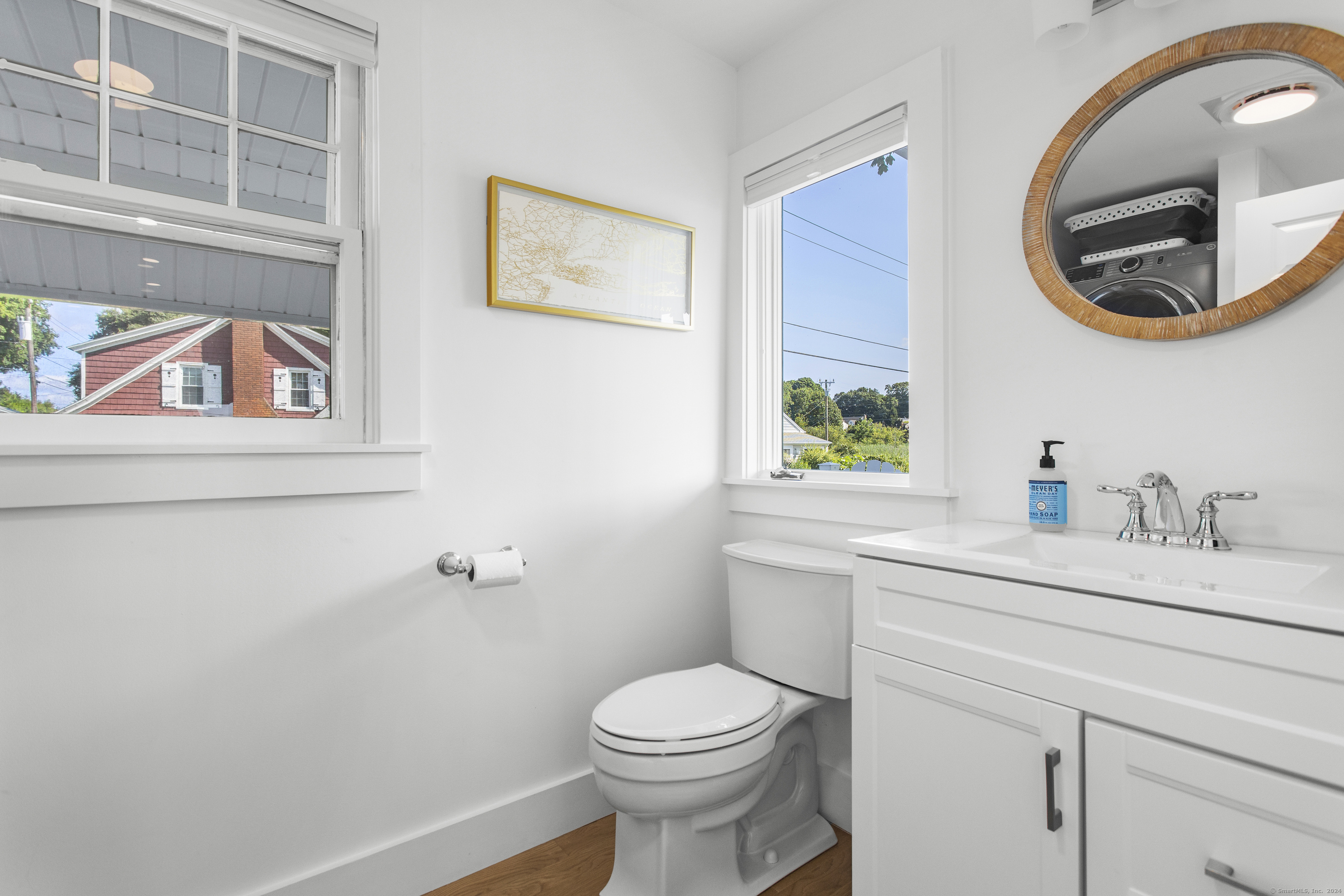 15 Cottage Road Old Lyme, CT 06371 - Photo 13 of 26 a bathroom with a toilet a sink and mirror