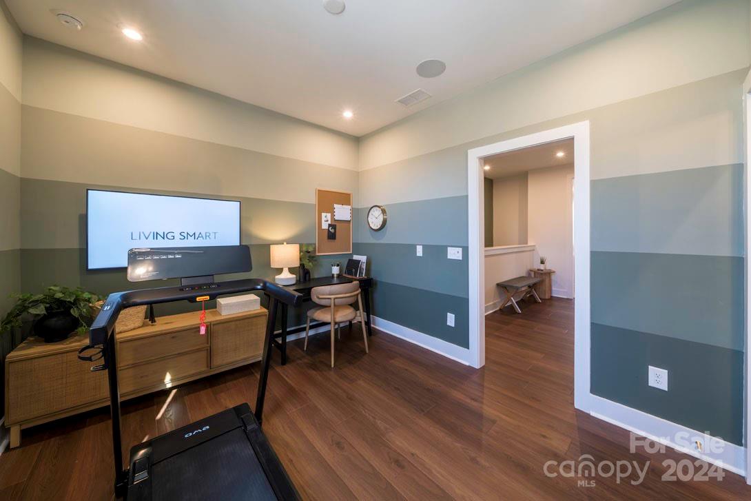 2055 Evolve Way Charlotte, NC 28205 - Photo 29 of 40 a living room with furniture and a flat screen tv