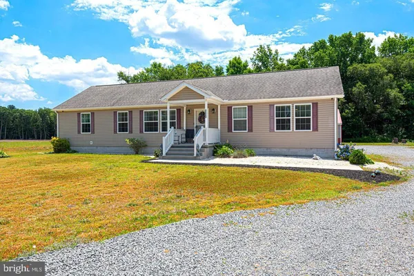 a front view of house with swimming pool and yard