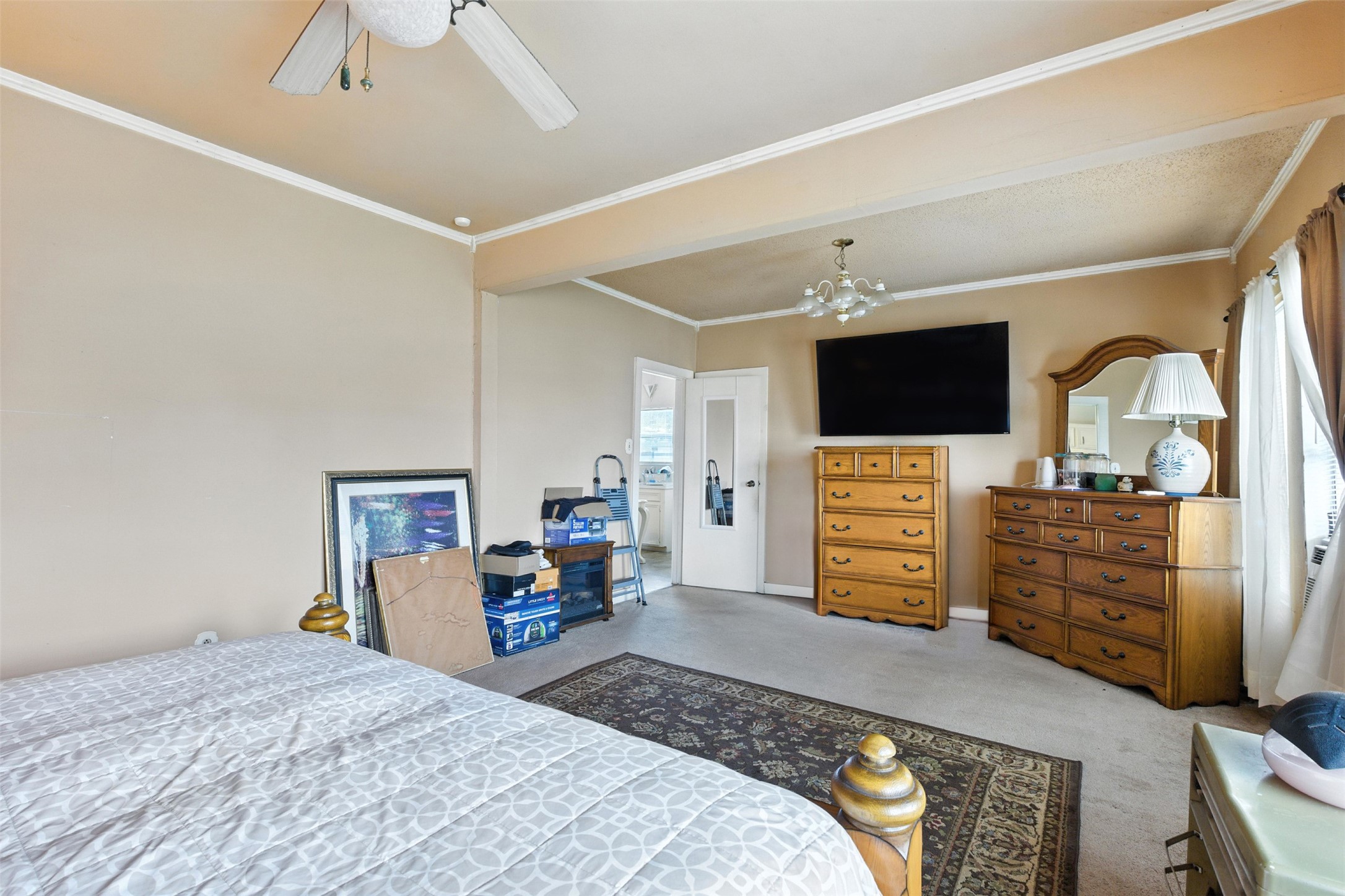 619 10th Street Hempstead, TX 77445 - Photo 14 of 27 a bedroom with a bed and flat screen tv