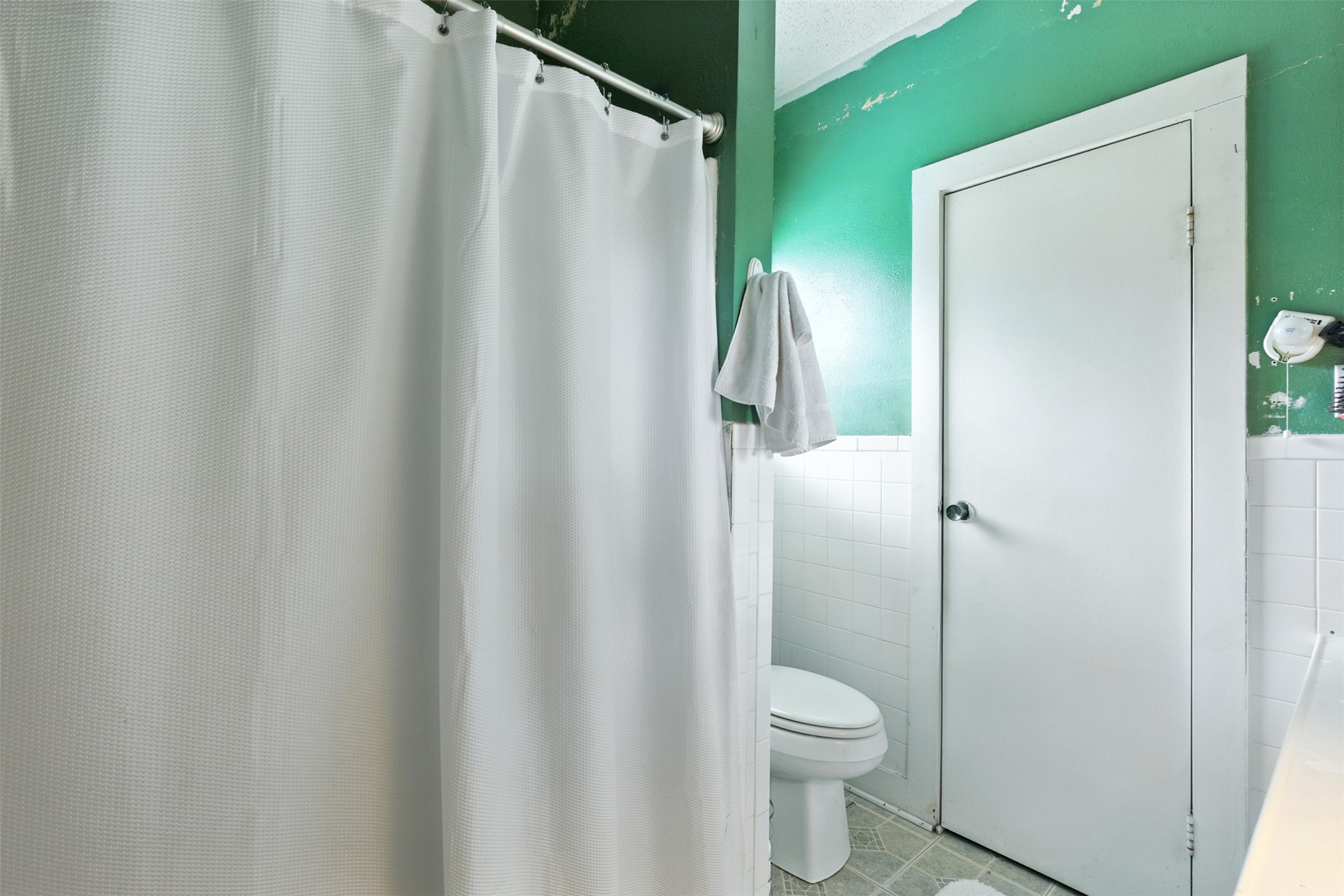 619 10th Street Hempstead, TX 77445 - Photo 16 of 27 a bathroom with a granite countertop toilet and a shower