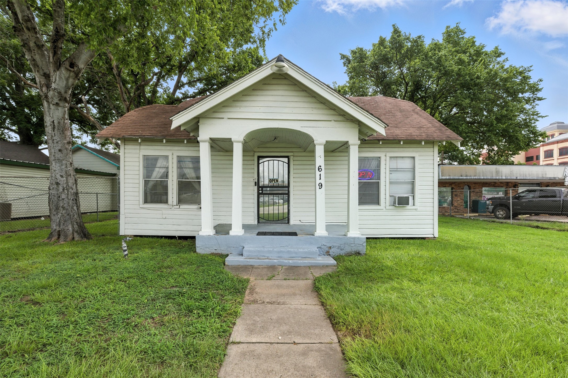 619 10th Street Hempstead, TX 77445 - Photo 25 of 27 a front view of a house with a garden