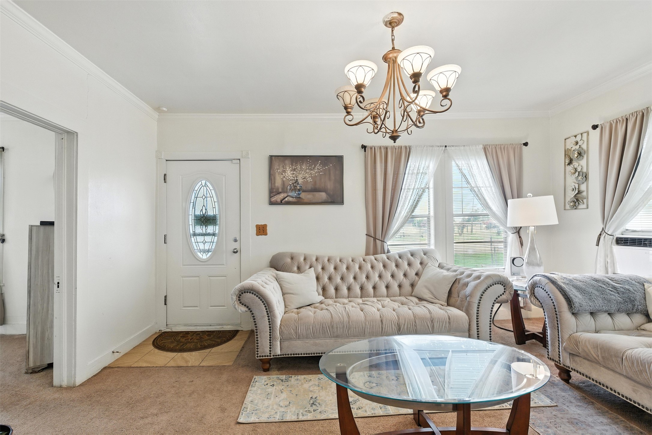 619 10th Street Hempstead, TX 77445 - Photo 4 of 27 a living room with furniture a chandelier and a window
