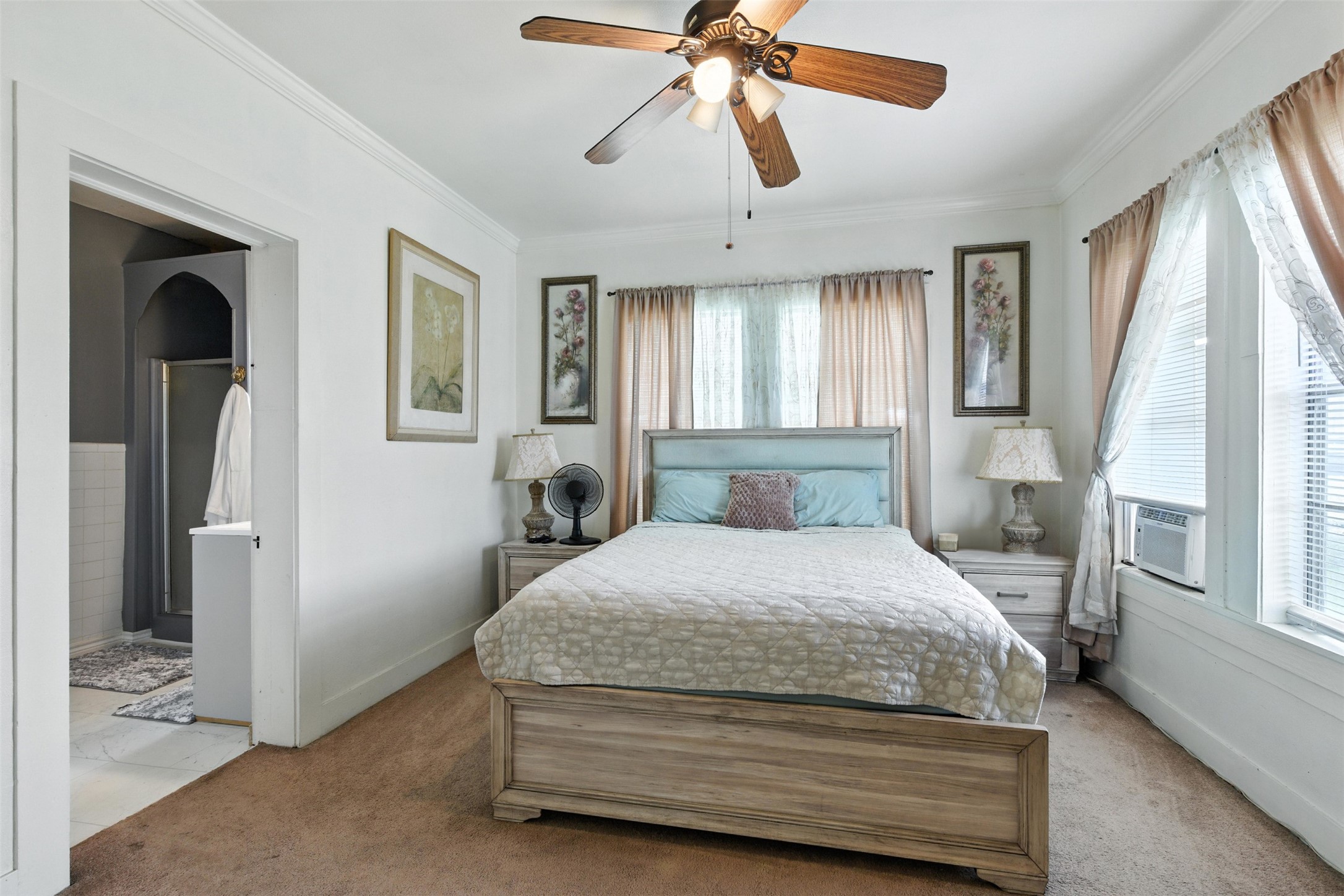 619 10th Street Hempstead, TX 77445 - Photo 5 of 27 a bedroom with a bed and a chandelier