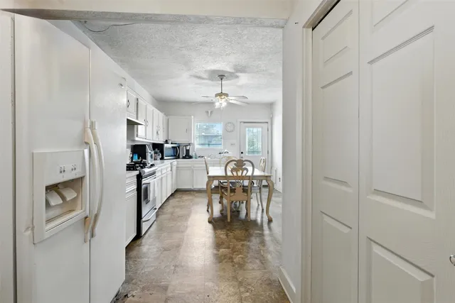 a view of a kitchen and dining room
