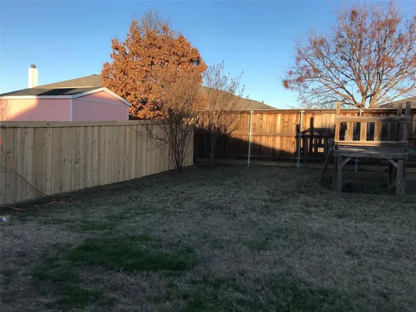 a house view with a backyard space