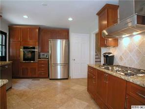 522 Ellsworth Road Charlotte, NC 28211 - Photo 3 of 16 a kitchen with stainless steel appliances granite countertop a refrigerator a stove a sink and a microwave
