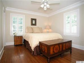 522 Ellsworth Road Charlotte, NC 28211 - Photo 8 of 16 a bedroom with a bed and wooden floor