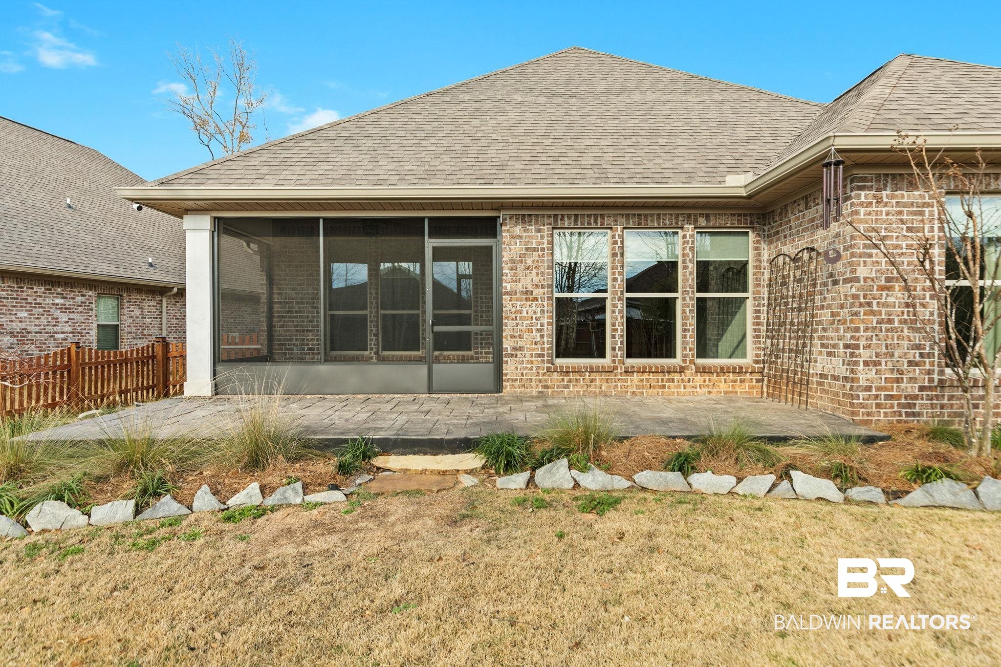 31654 Canopy Loop Daphne, AL 36527 - Photo 57 of 64 Rear view of property featuring a sunroom, roof with shingles, and brick siding