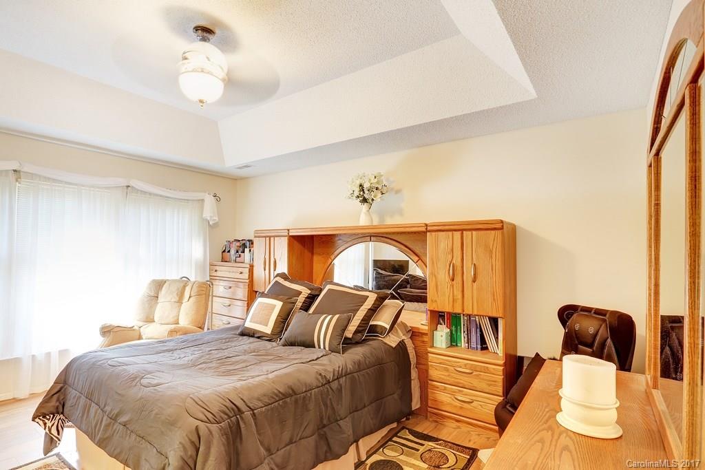 113 Banks Ridge Road Fort Mill, SC 29715 - Photo 11 of 21 a bedroom with a bed and wooden floor