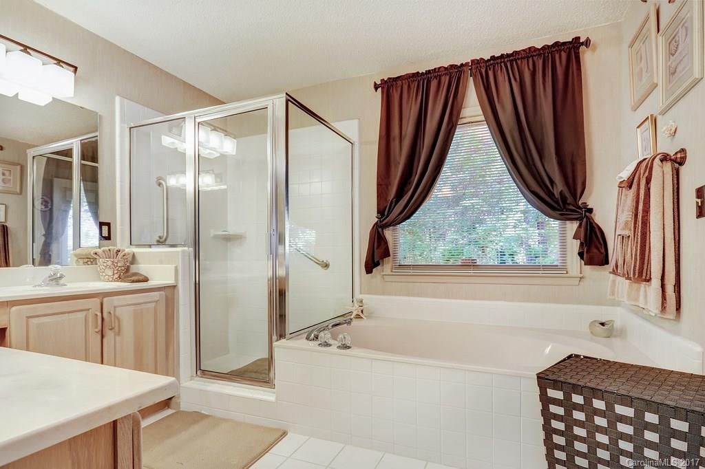 113 Banks Ridge Road Fort Mill, SC 29715 - Photo 12 of 21 a bathroom with a bathtub and a sink