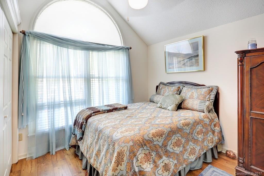 113 Banks Ridge Road Fort Mill, SC 29715 - Photo 14 of 21 a large bed sitting in a bedroom next to a window