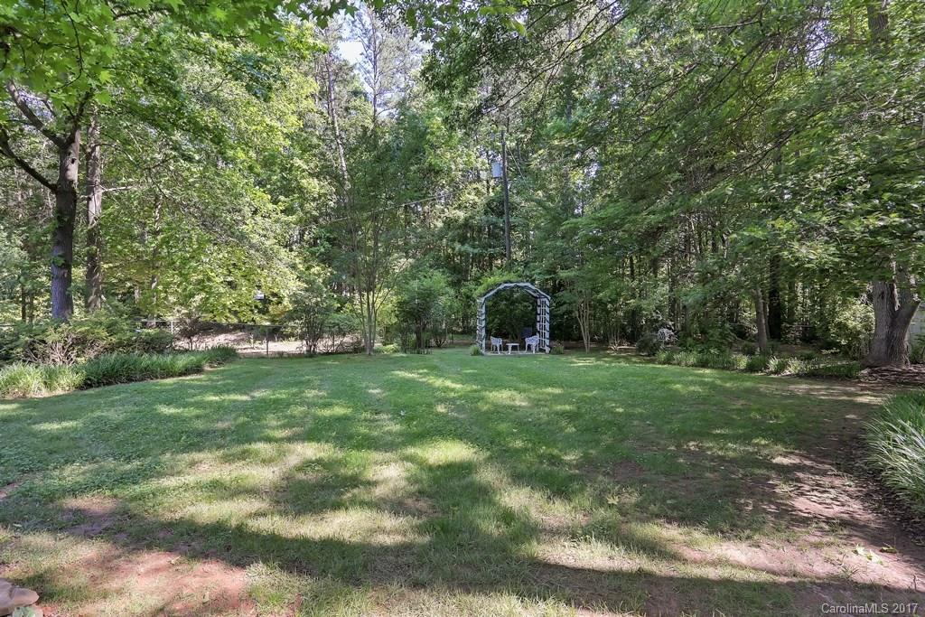 113 Banks Ridge Road Fort Mill, SC 29715 - Photo 18 of 21 a view of a backyard with large trees