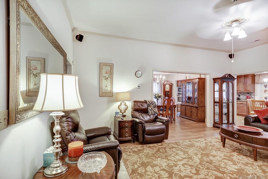 113 Banks Ridge Road Fort Mill, SC 29715 - Photo 4 of 21 a living room with furniture a window and a chandelier