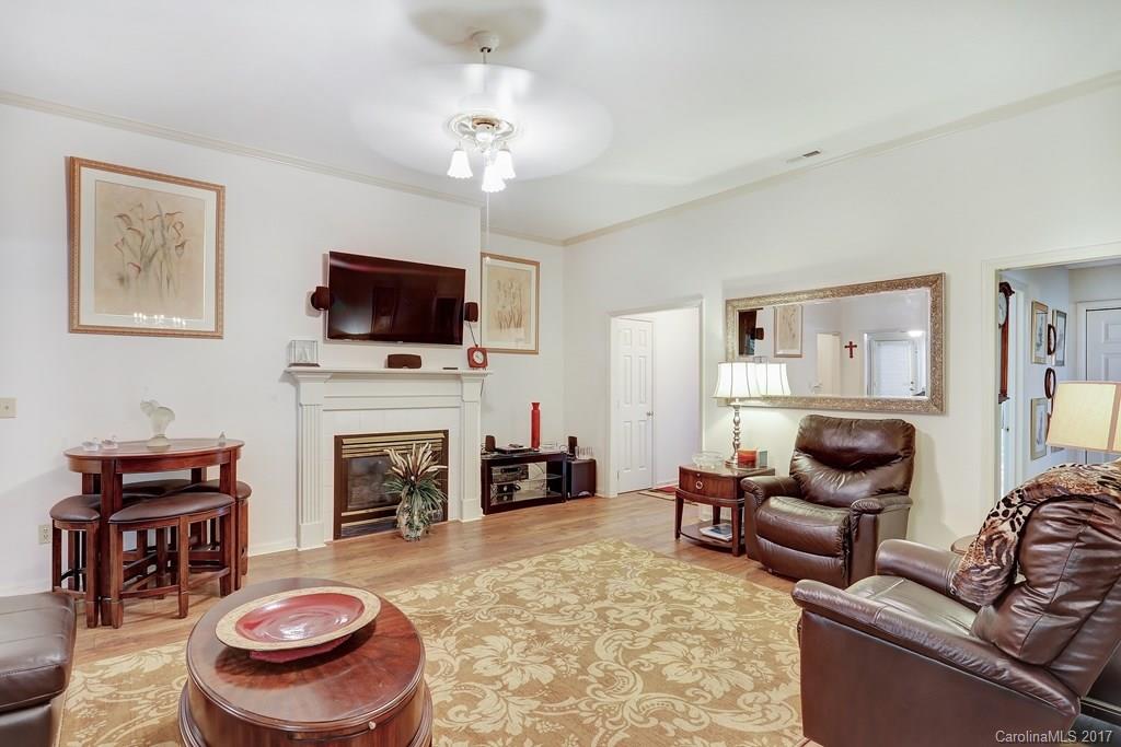 113 Banks Ridge Road Fort Mill, SC 29715 - Photo 5 of 21 a living room with furniture a fireplace and a flat screen tv