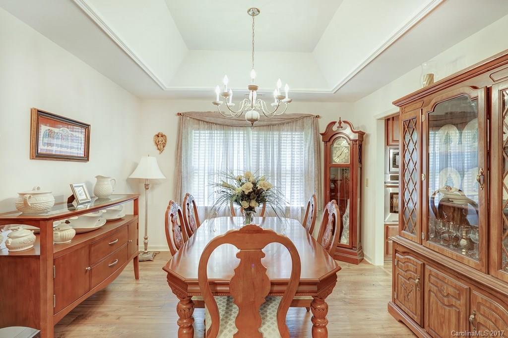 113 Banks Ridge Road Fort Mill, SC 29715 - Photo 6 of 21 a view of a dining room with furniture and a chandelier