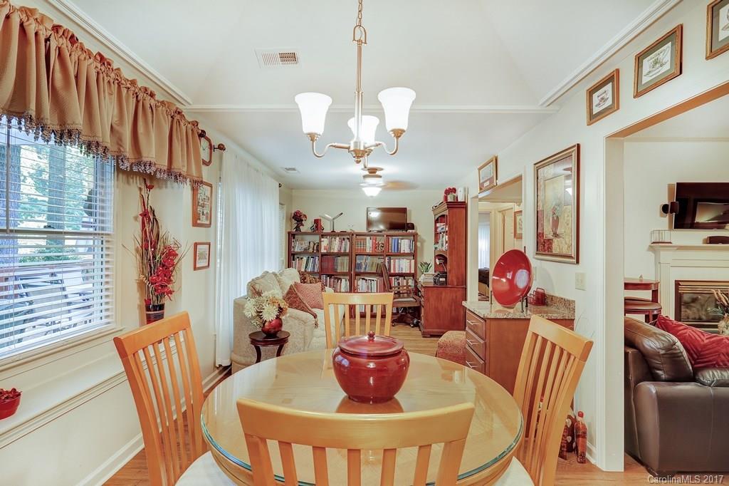 113 Banks Ridge Road Fort Mill, SC 29715 - Photo 9 of 21 a view of a dining room with furniture a chandelier and a window