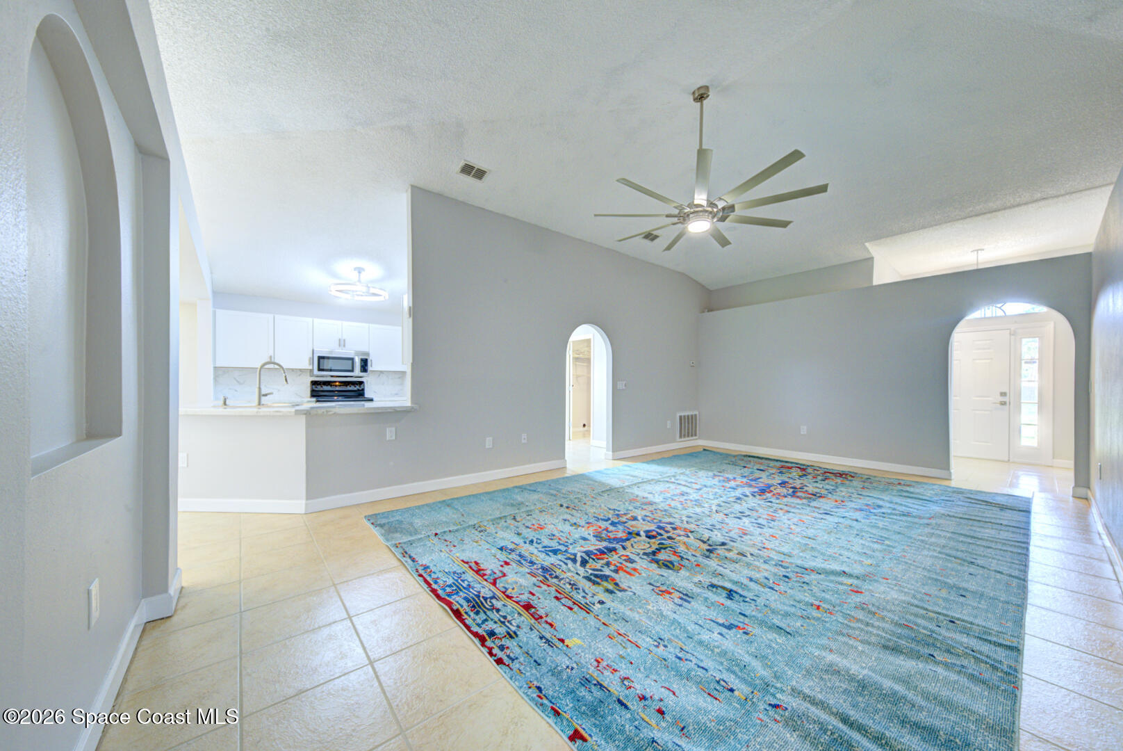 3353 Echo Ridge Place Cocoa, FL 32926 - Photo 10 of 51 living room with fan