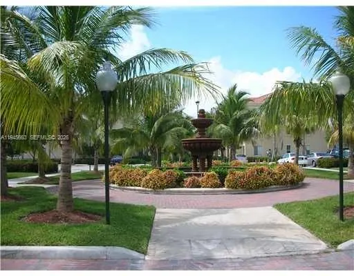 a view of a park with palm trees