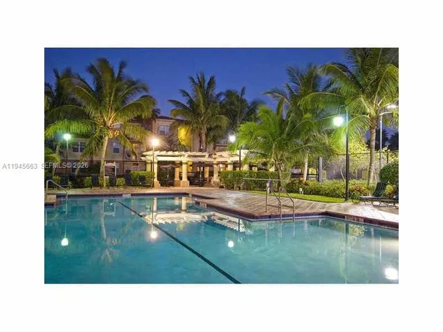a swimming pool with outdoor seating and yard