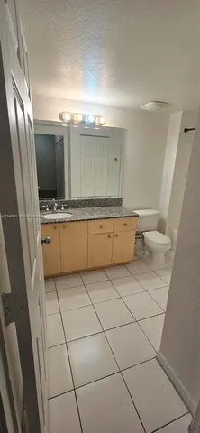 a bathroom with a shower and a toilet