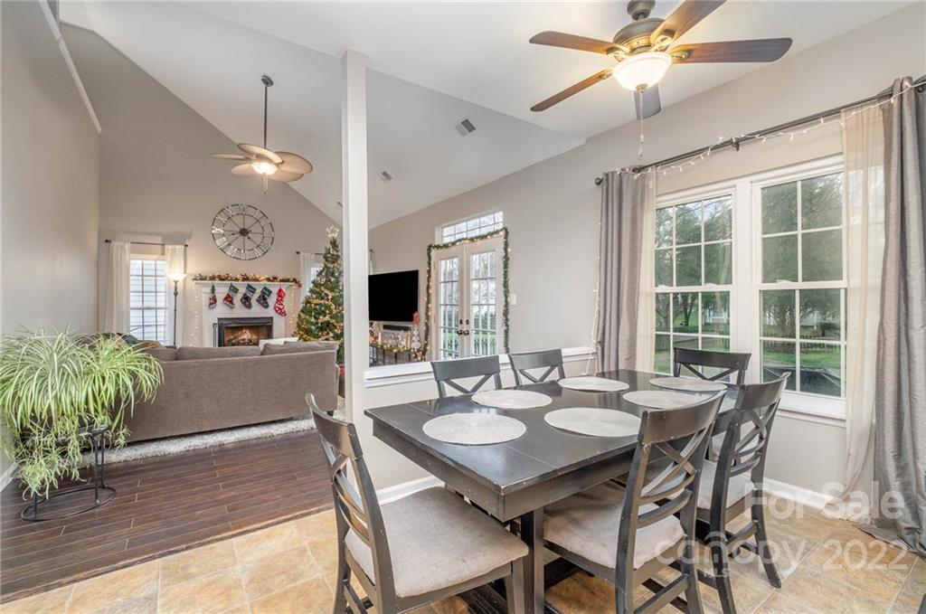 7201 Reedy Creek Road Charlotte, NC 28215 - Photo 11 of 30 a view of a dining room with furniture window and wooden floor
