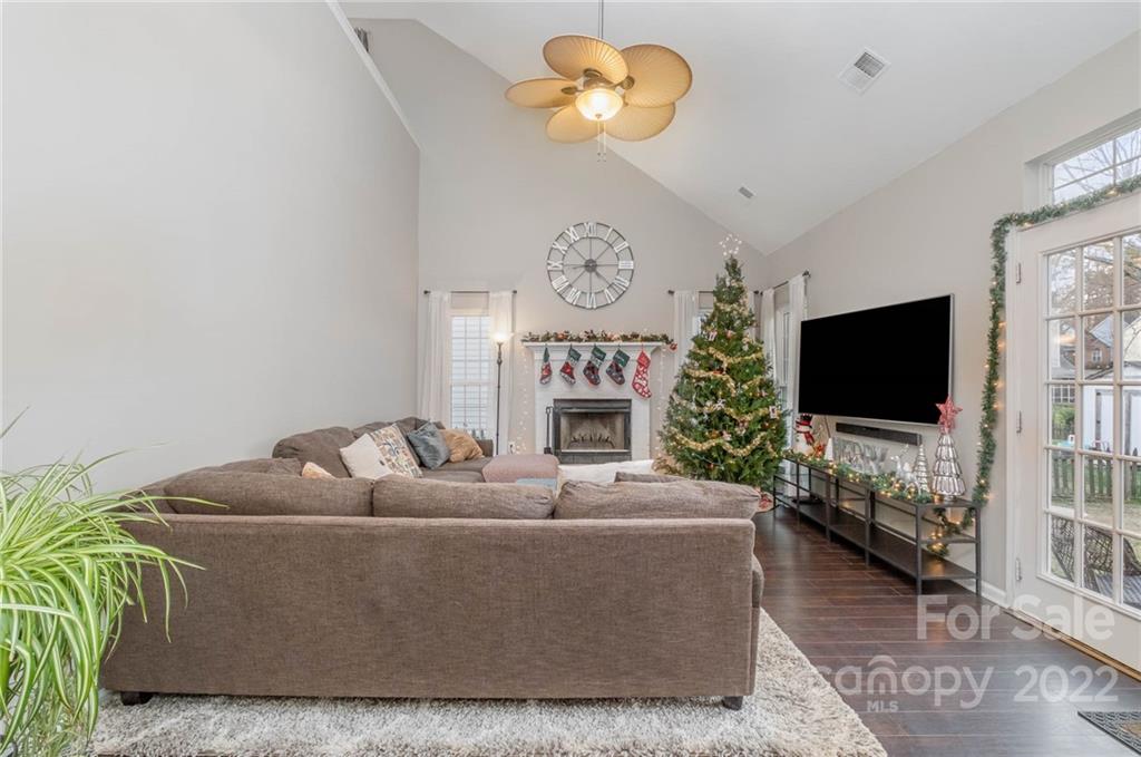 7201 Reedy Creek Road Charlotte, NC 28215 - Photo 13 of 30 a living room with furniture a flat screen tv and a window