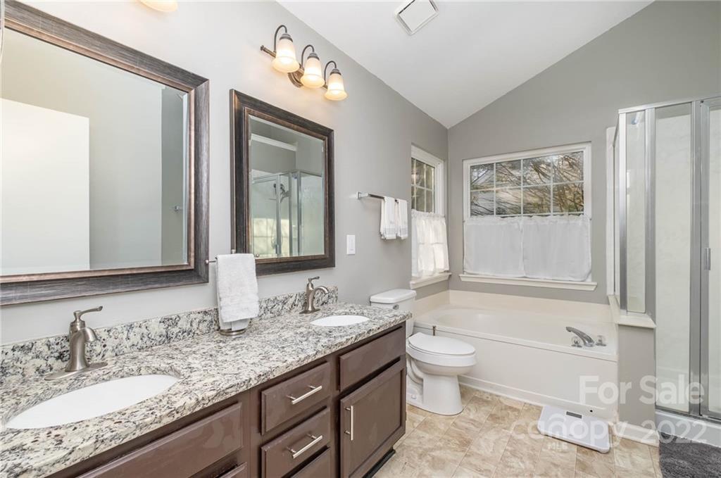 7201 Reedy Creek Road Charlotte, NC 28215 - Photo 21 of 30 a bathroom with a granite countertop sink toilet and shower