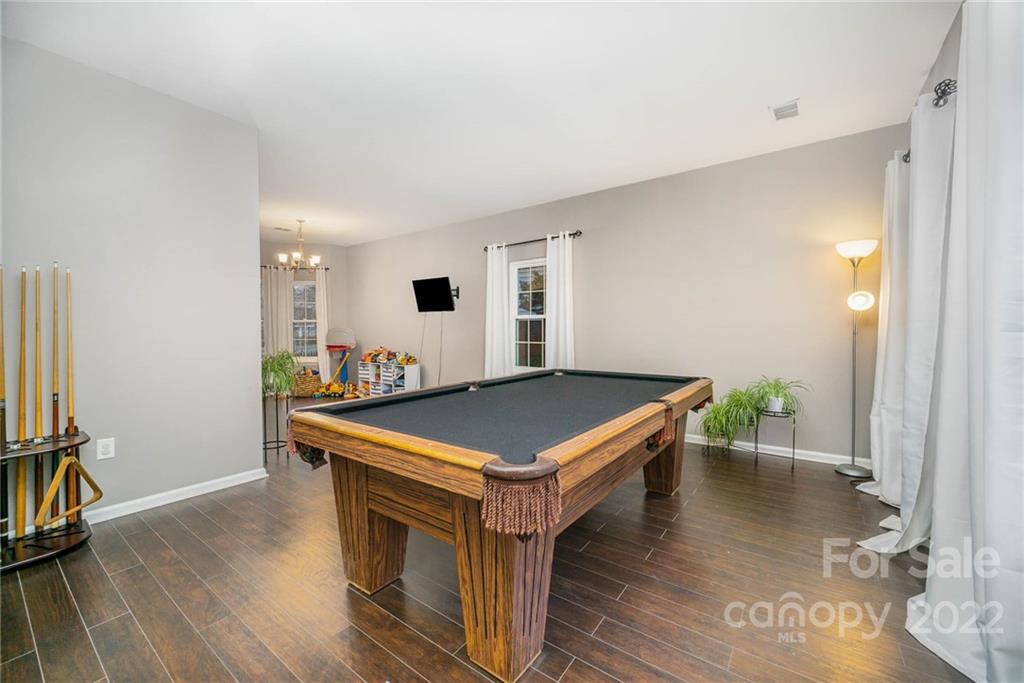 7201 Reedy Creek Road Charlotte, NC 28215 - Photo 4 of 30 a view of an empty room with wooden floor