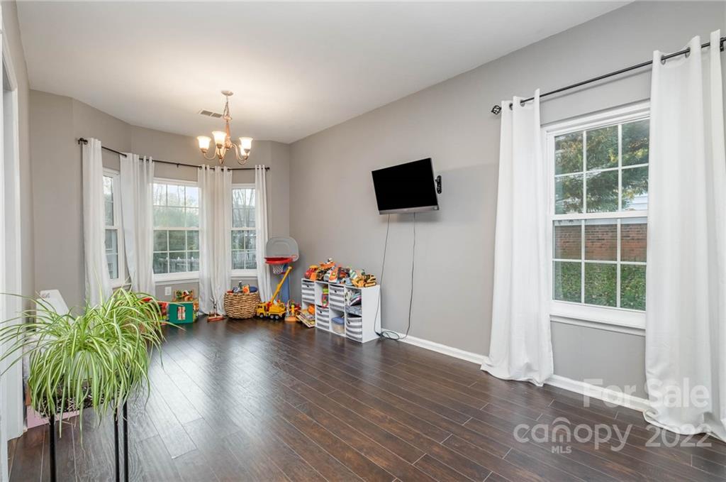 7201 Reedy Creek Road Charlotte, NC 28215 - Photo 6 of 30 a view of a livingroom with furniture and a flat screen tv