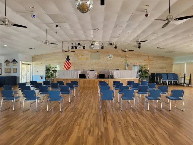 a living room with lots of furniture and wooden floors