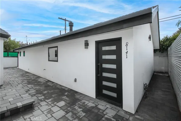 a front view of a house with parking space