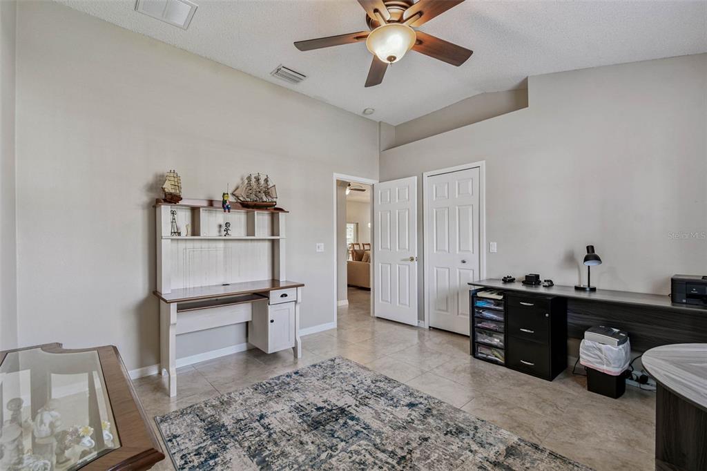 12202 Aaron Terrace Trinity, FL 34655 - Photo 27 of 41 a view of a workspace with furniture and wooden floor