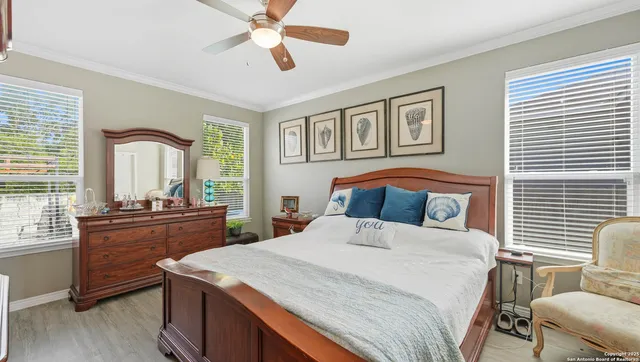 a bedroom with a large bed and a window